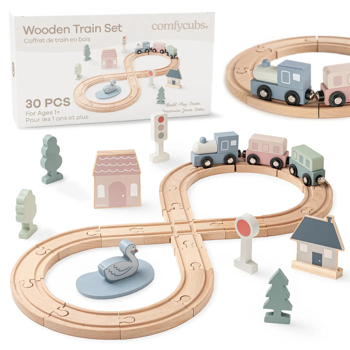 Wooden train set with tracks, trains, and accessories on a white background